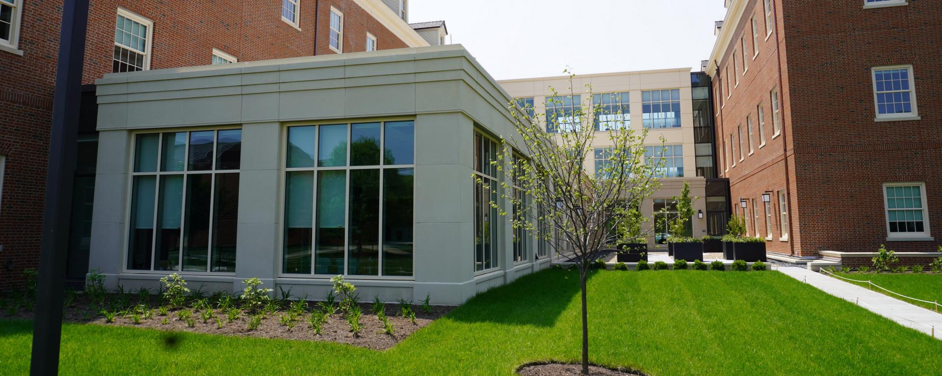 entry courtyard of red brick building