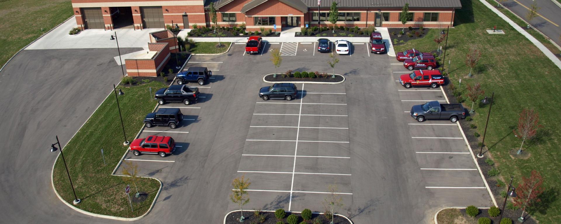 aerial of back parking lot and back profile of firehouse