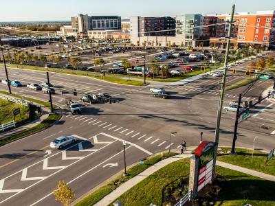 roadway intersection with shopping center development on one side