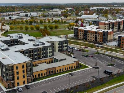 aerial photo of apartment building with park